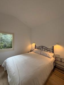 Ένα ή περισσότερα κρεβάτια σε δωμάτιο στο La Caseta de l'Adela