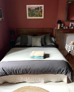 Postel nebo postele na pokoji v ubytování Le bain d'Alice