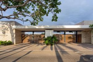 a modern house with a stone facade at Vista Natura, Luxury Home Near the Beach in Nuevo Vallarta 