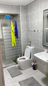 a bathroom with a toilet and a shower and a sink at كابيلا شرم الشيخ جنوب سيناء in Sharm El Sheikh