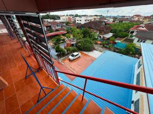 a view of a city from a balcony with a car at OYO 75596 The Sirisuk House in Ban Nong Nae