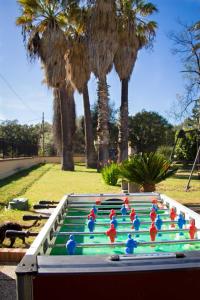 a group of plastic figurines sitting on top of a pool at Il Nido del Falco in Pula
