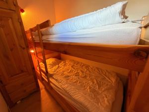 Ένα ή περισσότερα κρεβάτια σε δωμάτιο στο Mottaret Cimes 2- Studio cabine - Pied des pistes - Sud