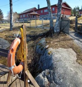 a life preserver on a bench in a park at Mission Guesthouse in Gäddnäs