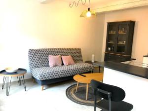a living room with a couch and a table at Le Sémillon in Bandol +12 photos