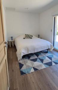 Postel nebo postele na pokoji v ubytování La Marilène Grange avec vue exceptionnelle + 35 fotografií