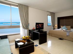 A television and/or entertainment centre at Atlas Essaouira Riad Resort