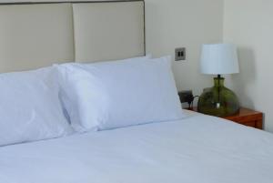 Ένα ή περισσότερα κρεβάτια σε δωμάτιο στο ICON Hotel +2 φωτογραφίες