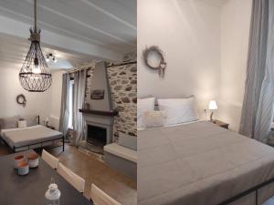 a bedroom with a bed and a living room with a fireplace at Charming Apartments in Trikeri Village in Tríkeri