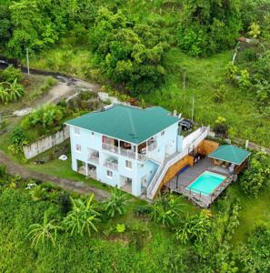 an aerial view of a house with a swimming pool at La Maison d'Abigaelle in Le François