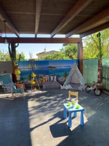 a patio with a table and a tent at Casa de sueños Benasha con piscina, zona infantil y parking privado in Deltebre