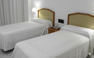 Postel nebo postele na pokoji v ubytování Del Mar Hotel & Spa + 15 fotografií