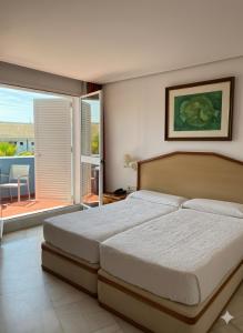 Postel nebo postele na pokoji v ubytování Del Mar Hotel & Spa