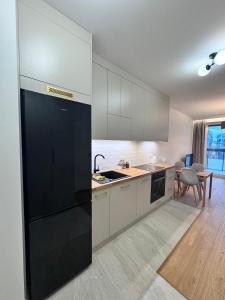 Kuchyň nebo kuchyňský kout v ubytování Forest Apart IX Aleje Jerozolimskie