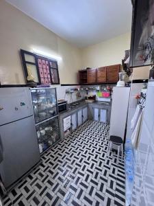 a kitchen with a refrigerator and a counter top at Hadi house in Fès +20 photos