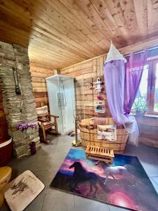 a room with a shower and a horse rug at Alba di Montanaria in Brosso