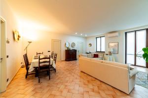 a living room with a couch and a table at Casa Tua Lake Maggiore in Castelletto sopra Ticino