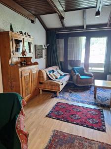 a living room with a couch and a table at Casa Lolli in Madonna di Campiglio