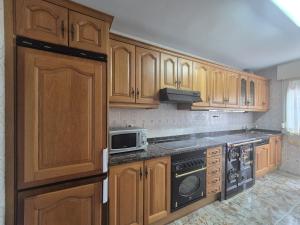 Kuchyň nebo kuchyňský kout v ubytování 213A by R2R Apartamento Maximino