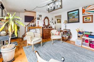 a living room with two chairs and a mirror at Near Trails, Parks and Orchards Germantown Retreat in Germantown