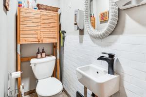 a bathroom with a toilet and a sink at Near Trails, Parks and Orchards Germantown Retreat in Germantown +17 photos