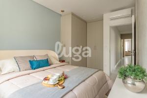 En eller flere senge i et værelse på Praia & Conforto – Apto 350m da praia