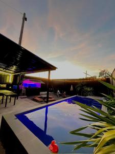 a swimming pool in the middle of a house at Boxify Cabins 