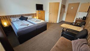 Postel nebo postele na pokoji v ubytování Pension Garni Zur Schamper Mühle