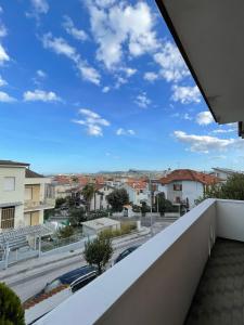 a view of a city from a balcony at Casa Vacanze Ilenia in Marina di Montemarciano +8 photos