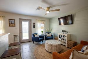 a living room with a couch and a table at AK Getaway Too ,where the waves the shore and worries melt away. in Port Aransas