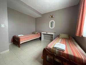 Giường trong phòng chung tại Cascada de Angeles