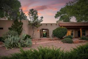 a house with a garden in front of it at Adobe Hacienda- Dreamcatcher Suite in Oak Creek +27 photos