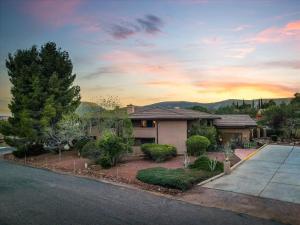 a house with a driveway in front of it at Adobe Village Studio Suite- Sundance in Oak Creek