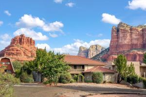a house in front of some red rocks at Adobe Village Studio Suite- Sundance in Oak Creek +22 photos