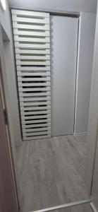 a room with a closet with a sliding door at Szabo Georgiana in Alba Iulia