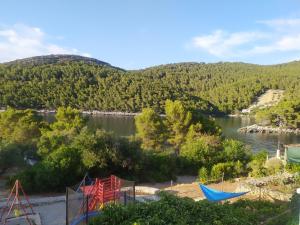 a view of a river with mountains in the background at Holiday house Ivko - Korcula in Vela Luka
