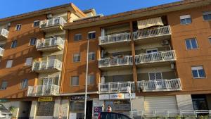 an apartment building with balconies on a city street at Da Chloe in Anagni