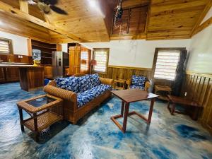 a living room with a couch and a table at Howler Landing Vacation Rental in Bermudian Landing +47 photos