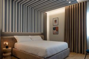 En eller flere senge i et værelse på Villa Galentino Suite Room