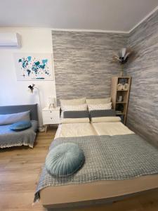 a bedroom with two beds and a wall mural at Szeged Sunshine Apartman in Szeged