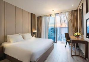 Ένα ή περισσότερα κρεβάτια σε δωμάτιο στο Panoramas Nha Trang Residencens +30 φωτογραφίες