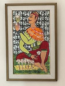 a framed picture of a woman holding a flower at Casa Dea - Bungalow Aphrodite in Hammamet Sud +91 photos