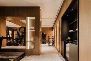 a hallway with a kitchen and a dining room at Lisbon Chiado Hotel & Spa in Lisbon