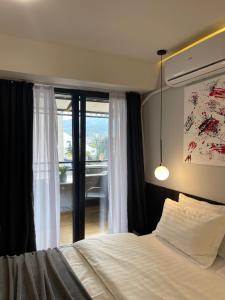 Postel nebo postele na pokoji v ubytování Mickitos Boutique Apartments + 24 fotografií