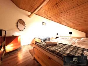 Postel nebo postele na pokoji v ubytování Aqua Duplex Apartman