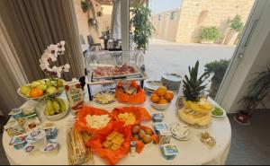 a table with a bunch of food on it at Dear Mary, B&B romantico vicino Lecce nel cuore del Salento in San Cesario di Lecce