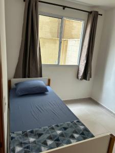 Postel nebo postele na pokoji v ubytování Apartamento Aconchego