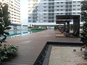 a patio with a swimming pool and a building at 168 Mall Selayang Batu Caves Totoro Theme Residence in Batu Caves
