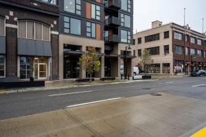 an empty street in a city with tall buildings at Heart of Downtown Apt with City View, Walkable to HotSpots in Spokane