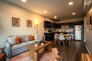 a living room with a couch and a table at Heart of Downtown Apt with City View, Walkable to HotSpots in Spokane +28 photos